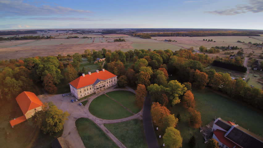 The manor and some small houses in Lihula. There are lots of trees in the area and small roads for passers