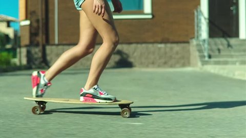 Slow motion shot of a beautiful style girl in skateboard in the city street Arkivvideo