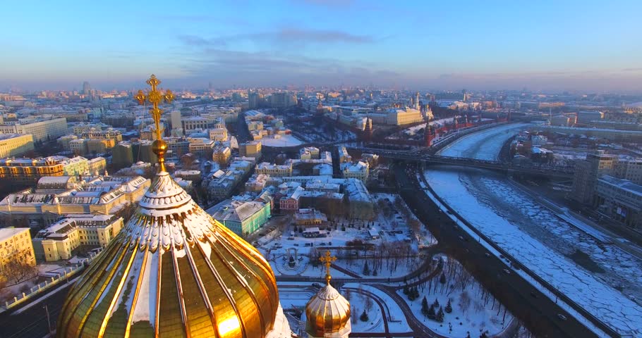 The impressive Cathedral of Christ the Saviour against the background of megapolis of Moscow. Aerial, flying backwards. The Cathedral took 40 years to build. The lower level was completed in 1841.