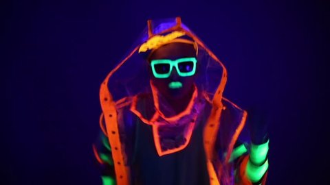 Guy dancing in neon costume