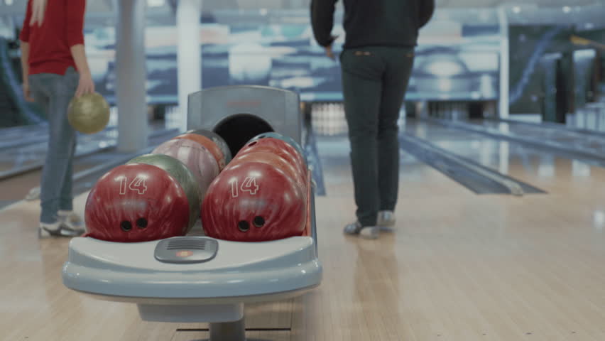Group of people playing bowling game