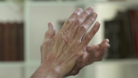 Man with arthritis pain in his hands