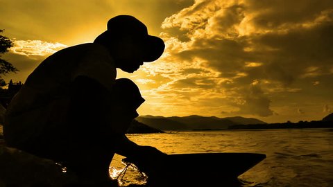 Gold panning in Thailand sunset
