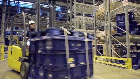 Loader operator working in warehouse