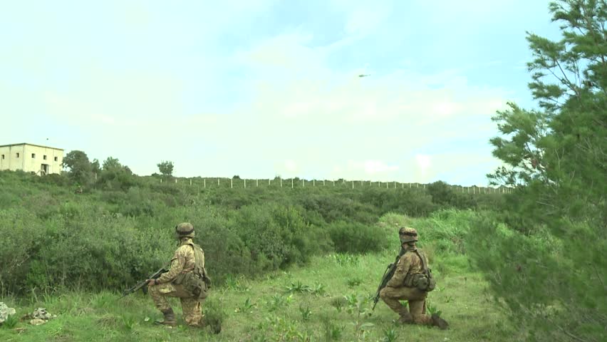 Military education and training-soldiers look helicopter
soldiers observed a helicopter above them