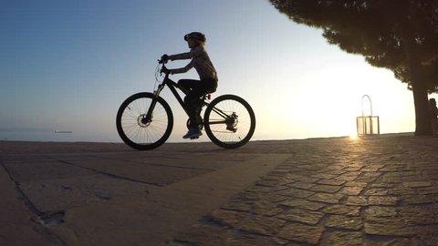 Cycling at sunset on beach