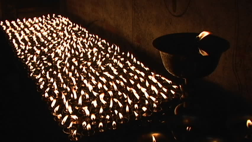 Buddhist candles burn inside a small temple circa 2005 in Kathmandu.