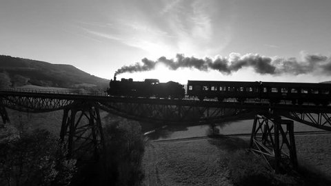 steam engine locomotive on railroad track. old historical train. nostalgic romantic background