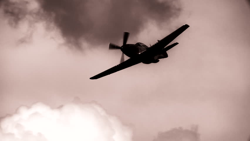 WWII P-51 Mustang Fighter flying in slow motion.  B&W.