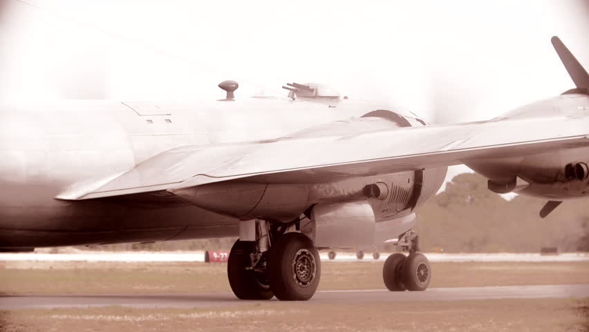 B-29 Super fortress taxiing on runway during WWII.  4K.