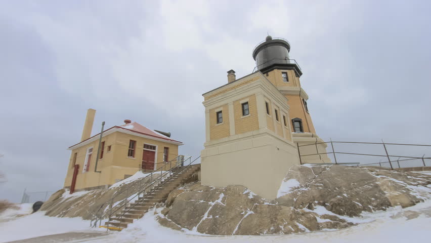 Split Rock Lighthouse on Lake Superior During a Cloudy Winter Day and Tourists Visiting Timelapse 4K UHD Ultra High Definition
