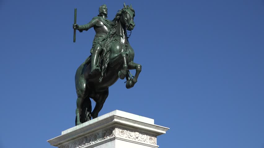 4K Bronze statue in Madrid downtown, tourism attraction of national symbol, monument by day