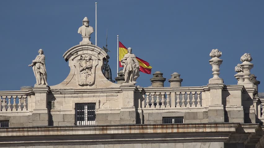 4K Beautiful Spanish architecture in Madrid downtown, national flag wave in iconic place by day