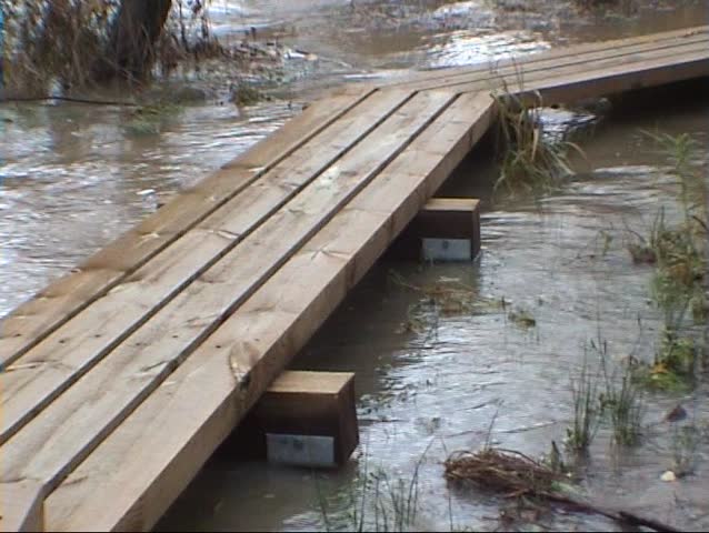 Wooden bridge covered by flood two
