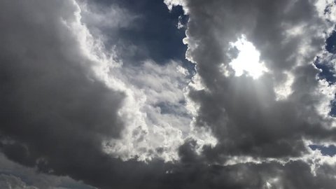 Bright and dark clouds with sun
