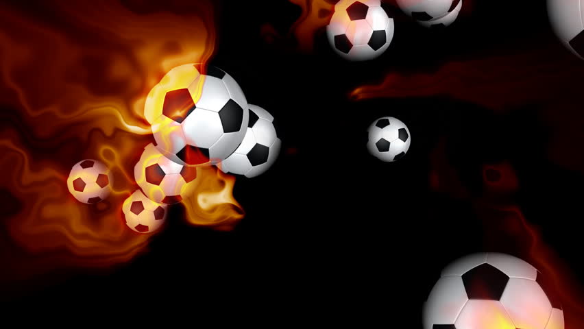 Soccer balls on fire against black