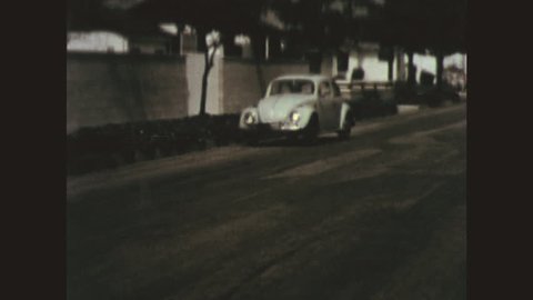 UNITED STATES 1970s: Young Man Gets Out of Car and Sees Car Crash