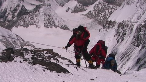 In the death zone climbing towards the summit of Everest - Climbers navigate difficult terrain