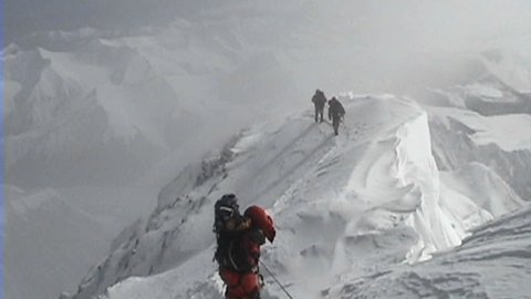 Climbers coming down from the summit of Everest over extremely exposed area