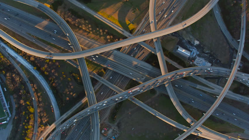 Atlanta Aerial v213 Flying vertical shot over Spaghetti Junction freeways panning at sunset. Royalty-Free Stock Footage #15470878
