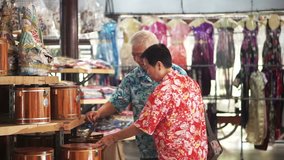 Asian senior elder tourist walking and shopping for local craft in Thailand - Powered by Shutterstock - Get 15% off with code: PIKWIZARD15