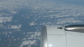 Airborne Perspective of Altocumulus Clouds in straight rows. over a Desolate Expanse of Empty Ocean. Taken over the Engine of an Airliner. Ungraded Raw footage