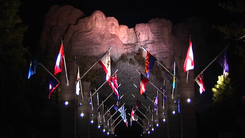 Mt. Rushmore at night with the Avenue of Flags in the foreground