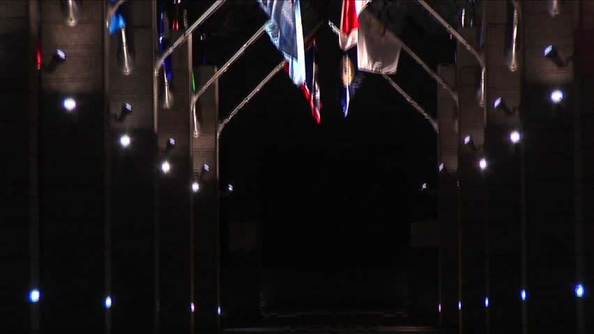 Tilt-up from the Avenue of Flags to Mt. Rushmore at night