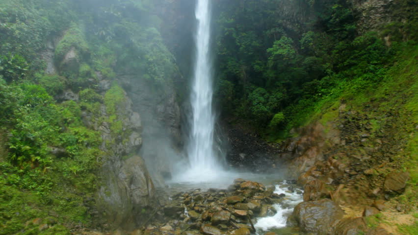 waterfall in ecuadorian rainforest, waterdrops comming thru the viewer