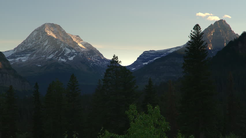 Mountain peaks with dusting of snow  in Glacier National Park.  Montana. 4K