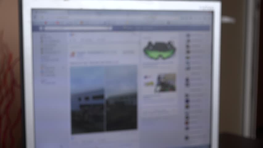 Browsing social media facebook page blur shot 4K, young children addiction site