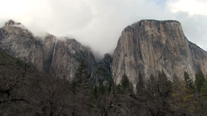 Sped Up Clouds Over Granite Cliffs And Waterfall Yosemite Park California
