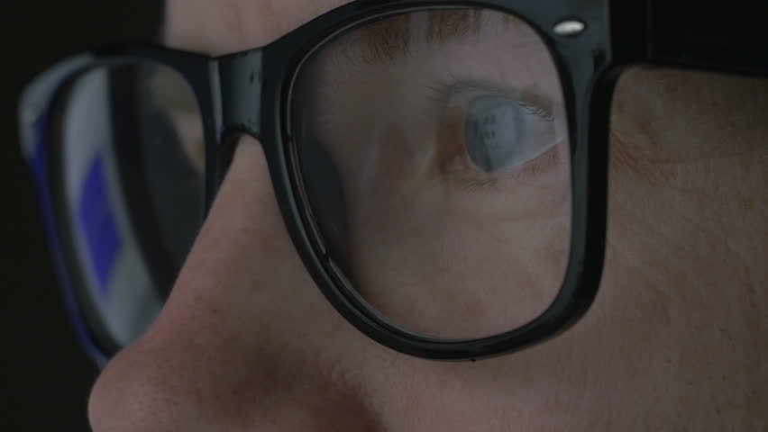Caucasian man web shopping jackets and the screen is reflected in the glasses. closeup shot | Shutterstock HD Video #15499798