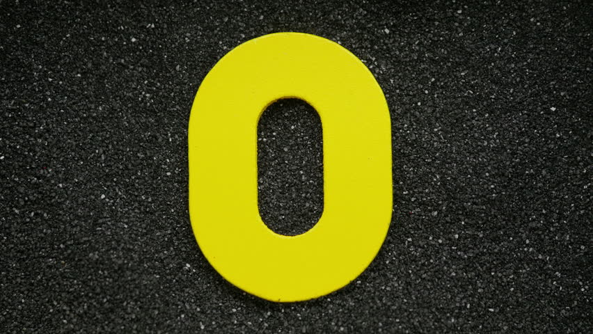 Wooden number in sand. For creation countdown.