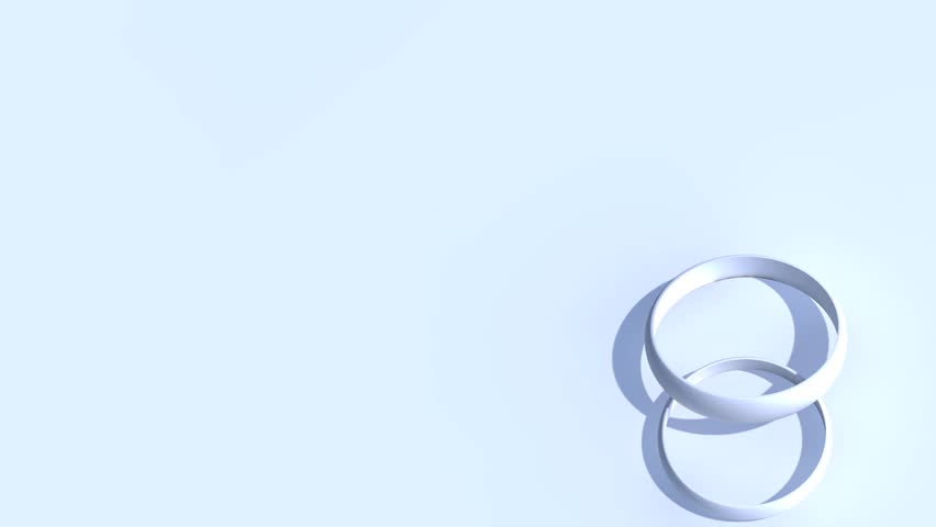 Computer generated looping animation of two wedding rings rotating.