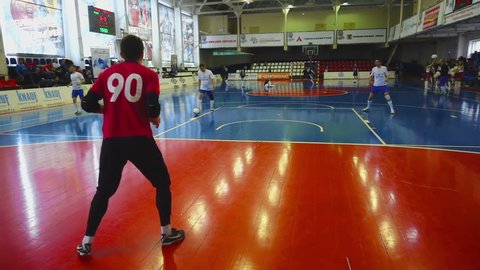 NOVOSIBIRSK, RUSSIA - MARCH 27, 2016: Goalkeeper in the warm-up the ball is kicked, Corporate Futsal tournament Gazprombank - Siberian Cup