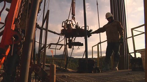 Drilling Rig work floor with worker / North Dakota - March, 2014