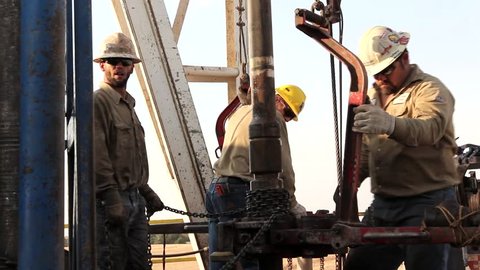 Drilling Rig Crew Changing out Drill String Close up / Texas - May, 2014