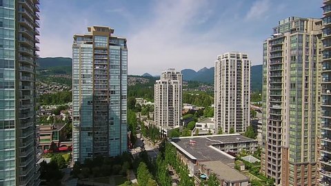 Aerial video of residential building towers in Coquitlam BC near Vancouver Canada.