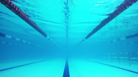 Underwater pool shot on the move along the track.: film stockowy