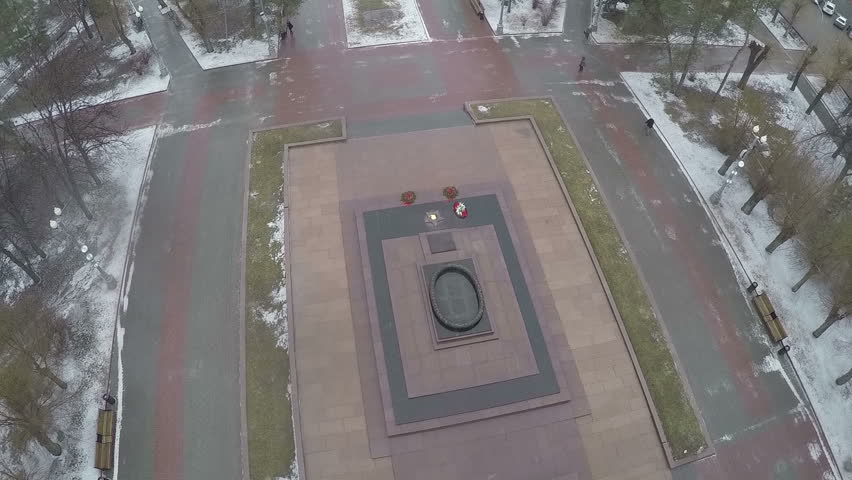 Aerial shot of eternal fire and marble stele on the Square of Fallen Soldiers in Volgograd, Russia. Monument in memory of Battle of Stalingrad 