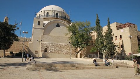 A beautiful tracking shot follows people walking in front of the Hurva Synagogue in Jerusalem/ Hurva Synagogue