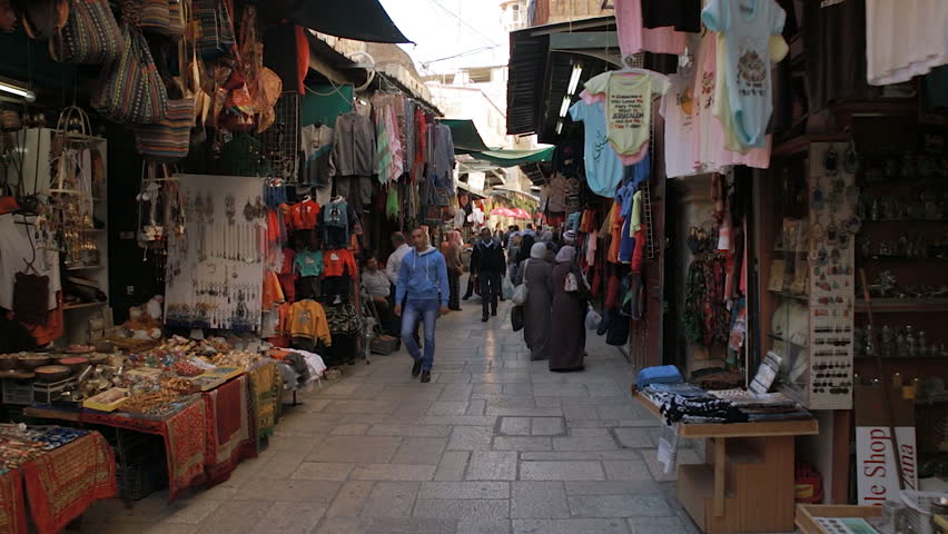 A tracking shot moving through the narrow streets of the Arab Quarter in Jerusalem/ Arab Quarter Shops Royalty-Free Stock Footage #15541036