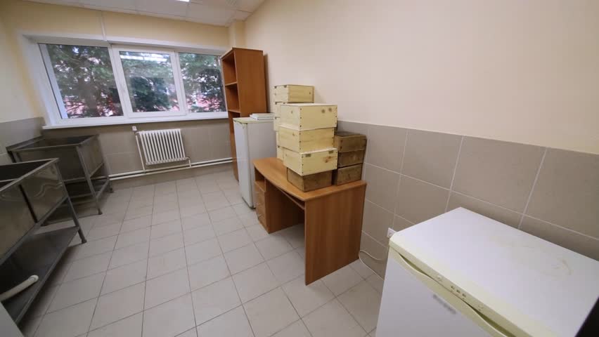 Panorama of small storage room with furniture and refrigerators in Zonal Center Cynology Service.