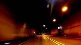 Car fast through tunnel, abstract with motion blur and glow, 4K video