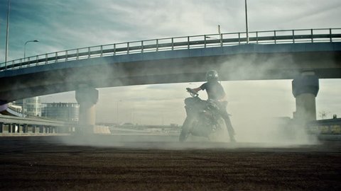 Smoking motorbike and rider 