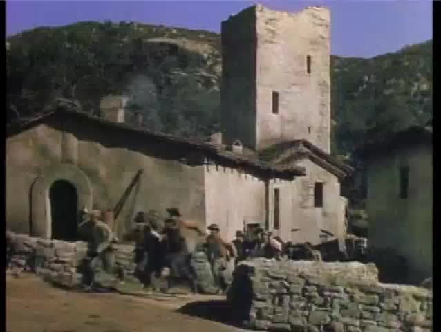 Angry townspeople running through street over bridge, 1940a