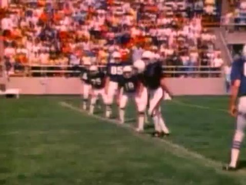Kick off at high school football game, 1980s