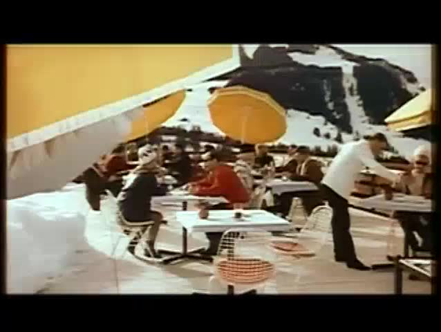 Criminal aiming gun at people in restaurant, 1960s