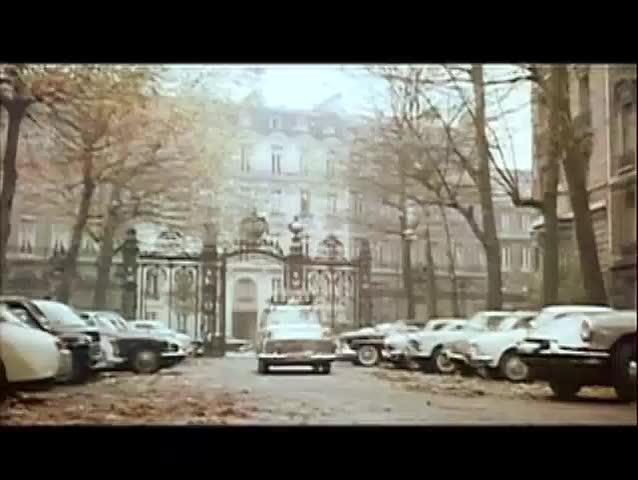 Peugeot parking in front of building in Paris, 1960s